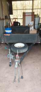 Tandem trailer 8 by 5 in good condition will consider boat trade