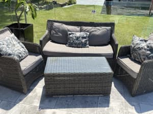 Outdoor wicker lounge, arm chairs and coffee table