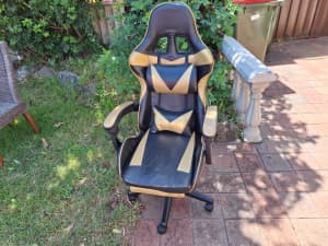 Gaming chair with foot rest. Some seat cracks. 