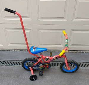 Kids 30cm bike with training wheels. $30. Pickup Doncaster East.