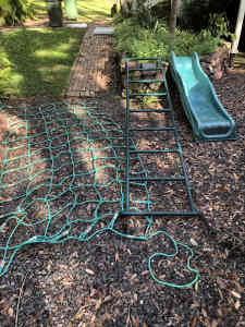 Playground equipment - monkey bars, slide and cargo net