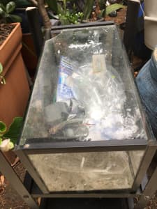 Fish tank with many extras. Light and pump included Paid $99 Se