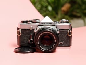 Tested Working 35mm SLR film camera Olympus OM-1 with lens