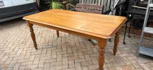 Solid timber dining table with turned legs