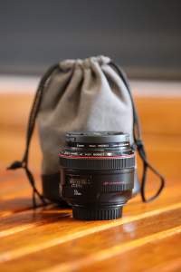 Canon EF-50mm f: 1.2 lens with pouch.