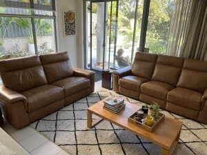 Two reclining leather lounges for sale