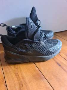 Kids black Nike shoes