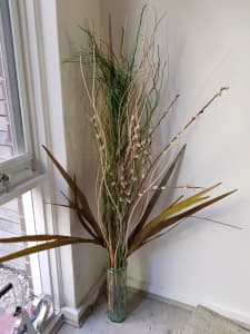 Dry arrangements with tall glass vase