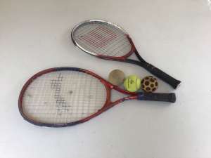 A pair of tennis racquets plus balls