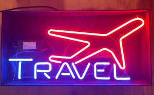Travel - genuine neon sign with blinking plane