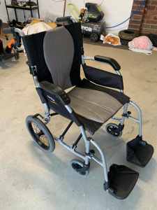 Collapsible travel wheelchair