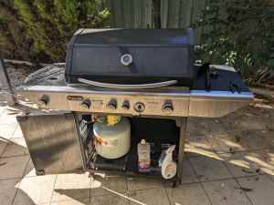BBQ Grill with tanks and accessories.