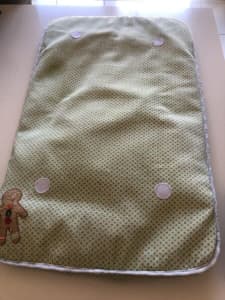 Baby change mat with gingerbread man cover