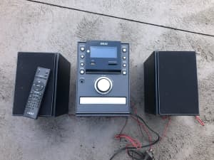 Akai music system with ipod dock, mp3, CD, clock and radio