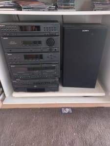 Vintage Sony stereo, has amp, dual tape deck, 5 disc cd and 1 speaker.