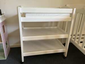 White wood baby changing table. Includes pad