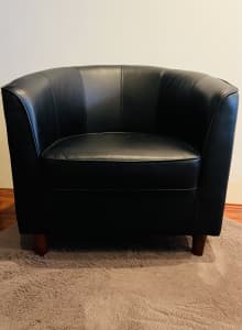 Black faux leather tub chair