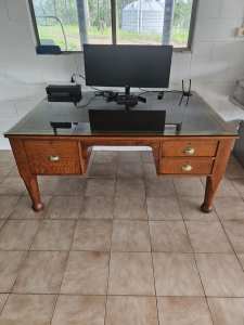 Large bankers desk with leather embossed surface and glass top