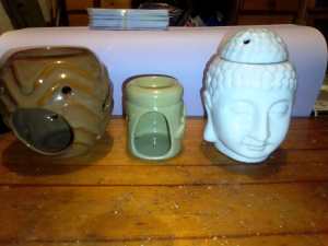 A set of three ceramic wax burners