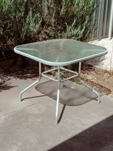 Glass-top outdoor table, medium size. Free.