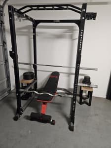 Home gym. Bars and weights. Power rack.