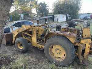 Old tractor/backhoe for sale runs well. 
