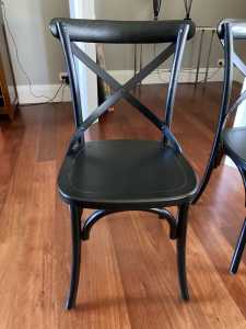 4 black timber dining chairs