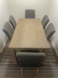 Excellent wooden dinning table with six chairs
