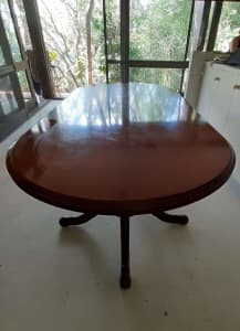 polished oval wooden table