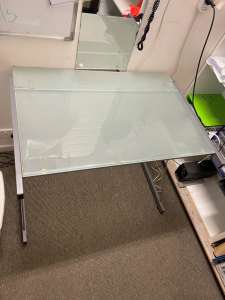 glass top desk with an office chair $50 ono