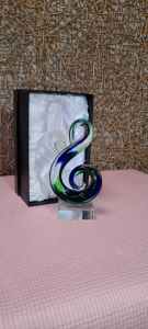 Small abstract swirl glass sculpture.