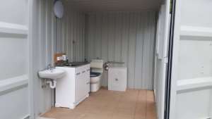 New container bathroom with laundry & kitchenette.