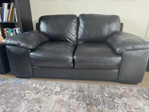 Black leather two seater sofa, very comfortable very good condition