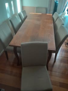 Solid wooden dining table with 10 fabric chairs