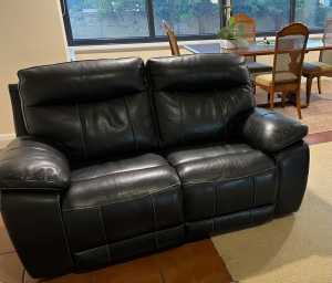 2 double reclining black leather lounges.