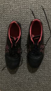 Red and black ASICS football boots