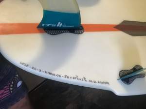 Slater models Akila aipa Flat earth surfboard