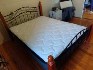 Queen bed, mattress and mattress protector
