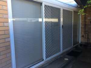 4600mm x 2100mm white aluminium sliding door with security mesh harden