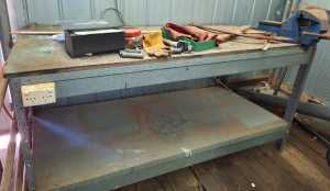 Galvanised workbench with wooden top and shelf underneath and vice