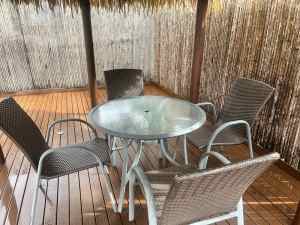 Glass stable and 4 Rattan Chairs outside