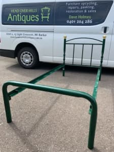 Steel frame single bed, green and brass. Two available. 