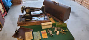 Singer sewing machine model no 201K come with a lot of bits sale as 