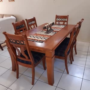 Solid timber dining table with 6 cushion chairs