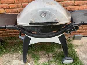 Weber Family BBQ with patio cart in used condition