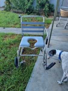 Shower chair with wheels/commode in really good condition