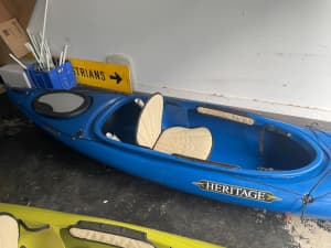 2 kayaks with paddles and wrist ropes