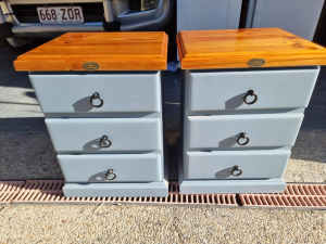 PAIR OF SOLID TIMBER STOCKMAN BEDSIDE TABLES WITH RUNNERS