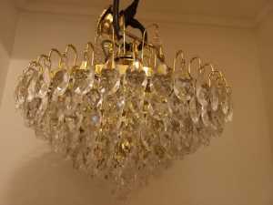Chandelier with acrylic crystals, ideal for a stairwell.