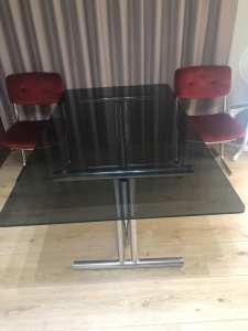 Smoky glass dining table and 6 chairs.